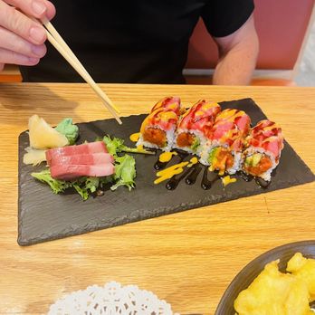 Wasabi - a person eating sushi with chopsticks - Sushi Bars Near Me - Elizabethtown, Kentucky Wasabi - a person eating sushi with chopsticks - Sushi Bars Near Me - Elizabethtown, Kentucky