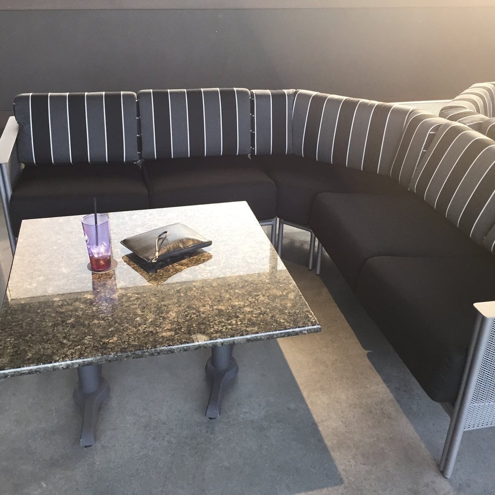 Topgolf - Each bay has an L-shaped booth for up to 6 guests. - Golf Near Me - Charlotte, North Carolina Topgolf - Each bay has an L-shaped booth for up to 6 guests. - Golf Near Me - Charlotte, North Carolina