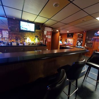 Woody's Place - a bar with black leather chairs - Restaurants Near Me - Merrill, Michigan Woody's Place - a bar with black leather chairs - Restaurants Near Me - Merrill, Michigan