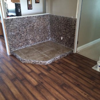 Floors By Matt - The fireplace was completed using 12 x 12 light brown ceramic tiles for the floor.  The ceramic will protect the house from t... - Flooring Near Me - Mount Olive, Illinois