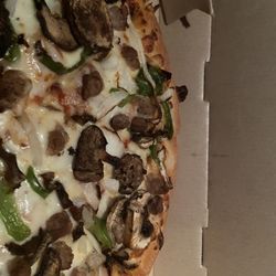 Pizza Hut - No pork or pepperoni, only sausage, onions, peppers, cheese, sauce and mushrooms.