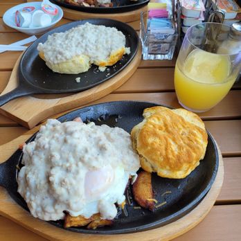 Peach Valley Cafè - Peach Valley skillet, with side of biscuits and gravy, there's a lot going on under that gravy. Delicious. Peach Valley Pickler's Skillet - Breakfast & Brunch Near Me - Heathrow, Florida