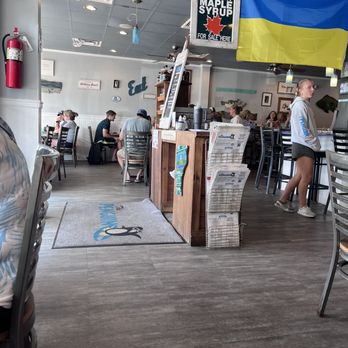 The Penguin - people sitting at tables in a restaurant - Burgers Near Me - Bethany Beach, Delaware The Penguin - people sitting at tables in a restaurant - Burgers Near Me - Bethany Beach, Delaware