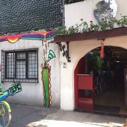 La Santa Gula - The entrance decorated with Street Art by Ocote