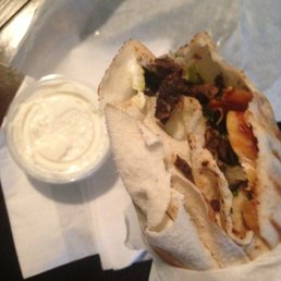Small mixed chicken and beef shawarma with all the fillings and a side of garlic sauce Small mixed chicken and beef shawarma with all the fillings and a side of garlic sauce