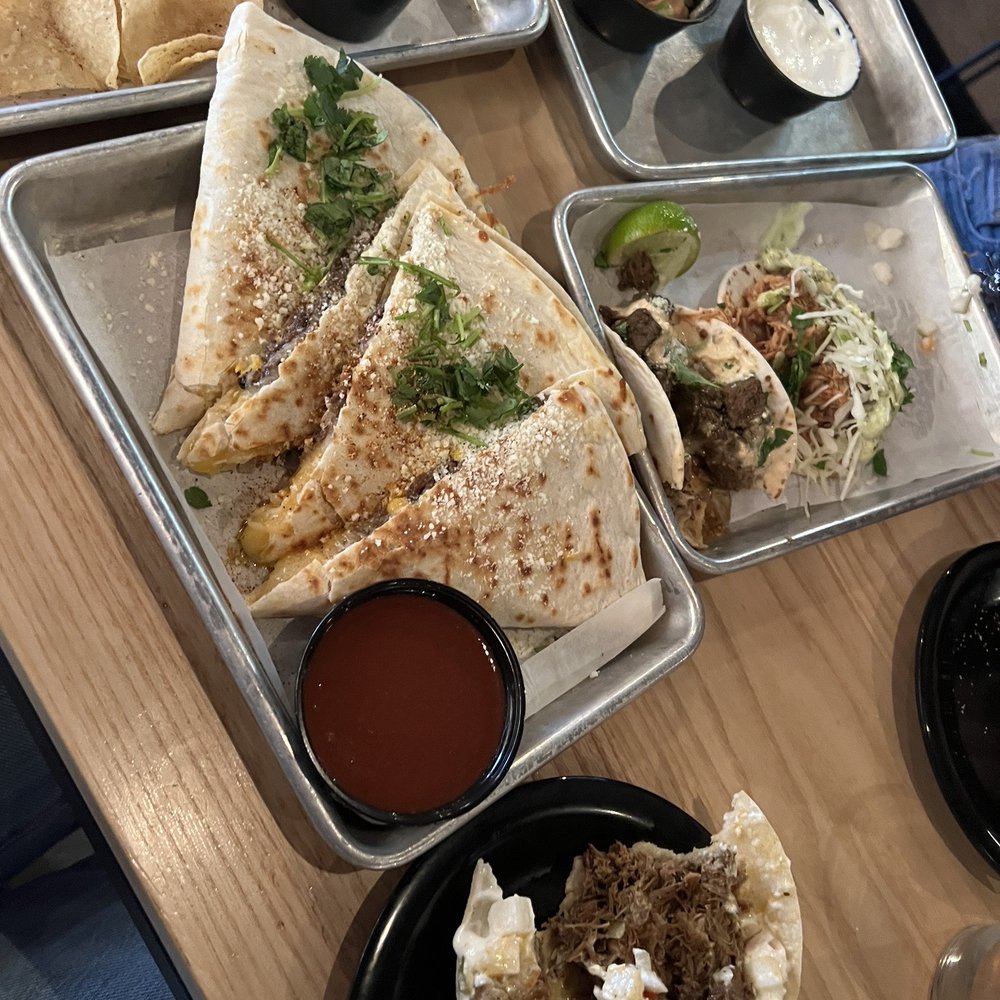XO Taco - Birria Dilla w/ shredded beef, and a already half gone Carnitas taco - Tacos Near Me - Syracuse, New York XO Taco - Birria Dilla w/ shredded beef, and a already half gone Carnitas taco - Tacos Near Me - Syracuse, New York