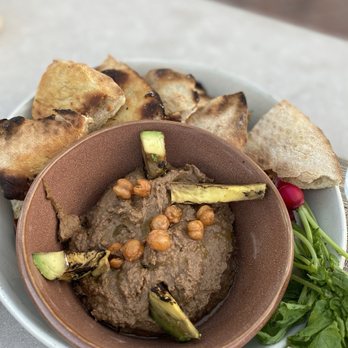 Belmond El Encanto Dining Room - Black Garlic Hummus: Charred avocado, aleppo oil, crispy chickpeas - New American Near Me - Santa Barbara, California Belmond El Encanto Dining Room - Black Garlic Hummus: Charred avocado, aleppo oil, crispy chickpeas - New American Near Me - Santa Barbara, California