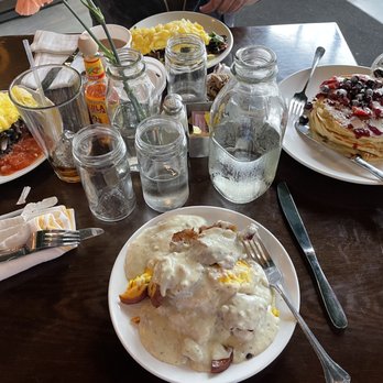 Rooster - Downtown - Rooster Slinger for me, Seasoned Black Beans 3 Egg Scramble (left), berries and creme fraiche pancakes (right) - Creperies Near Me - St. Louis, Missouri