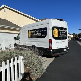 a van parked in front of a house a van parked in front of a house