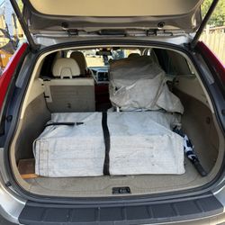 Grand Rental Station - 20 chairs folded fitted in rear of suv
