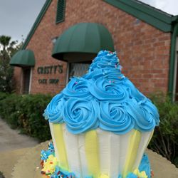 Cristy's Cake Shop - Storefront with cupcake.