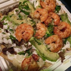 Tacos Los Amigos - Steak & shrimp fries ( cheese sour cream onions cilantro avocado rice ) get green sauce on the side with limes and green onions