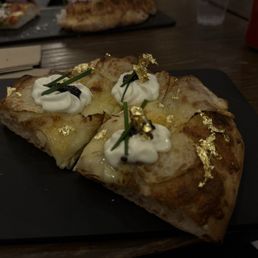 Pizza with gold leaf, and caviar Pizza with gold leaf, and caviar