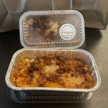 Goozzies - two pans of food on a table - Desserts Near Me