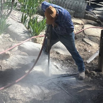 Prescott Fence - Drilling the first of twenty-two fence post holes in rock - Fences & Gates Near Me - Prescott, Arizona