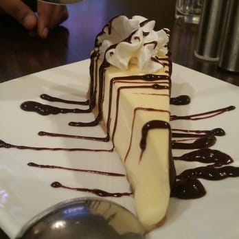 Amina Thai - Cheesecake with a chocolate  drizzle - Thai Near Me - Jamaica, New York