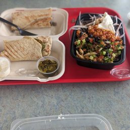 Chicken and Steak wrap mixed. Chicken and steak bowl mixed. Both dishes have a spicy red sauce and garlic sauce. Chicken and Steak wrap mixed. Chicken and steak bowl mixed. Both dishes have a spicy red sauce and garlic sauce.
