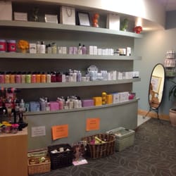 Essential Touch Women's Wellness Spa and Boutique - Philosophy product wall and the room entrance for manis/pedis