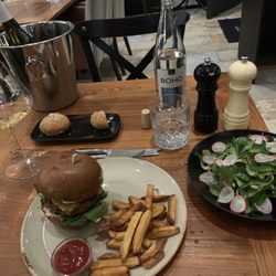 Pohostinec Monarch - Tasty medium rare ground steak burger and my healthy side salad and a bottle of Czech chard. Well balanced meal!