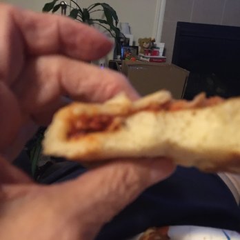 Little Caesar - Folded it bottom to top to spread toppings but not much there. Crust real thin in the middle and super thick on the outside as you can see. - Pizza Near Me - Penfield, New York Little Caesar - Folded it bottom to top to spread toppings but not much there. Crust real thin in the middle and super thick on the outside as you can see. - Pizza Near Me - Penfield, New York