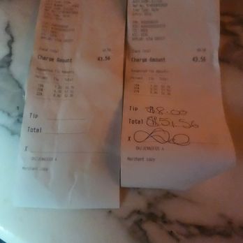 The Dakota Bar - Checked charged to the missing credit card when we gave the server 2 cards. It shows the 20% tip before the awful experience that unfolded. - Cocktail Bars Near Me - New York, New York The Dakota Bar - Checked charged to the missing credit card when we gave the server 2 cards. It shows the 20% tip before the awful experience that unfolded. - Cocktail Bars Near Me - New York, New York