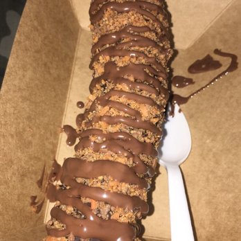 Balboa’s - Frozen banana dipped in chocolate covered in butter finger crumbs and a Nutella sauce on top - Desserts Near Me - Mesa, Arizona Balboa’s - Frozen banana dipped in chocolate covered in butter finger crumbs and a Nutella sauce on top - Desserts Near Me - Mesa, Arizona