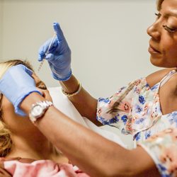 Beaux Arts Plastic Surgery & Med Spa - Dr. Nia Bank of Beaux Arts Plastic Surgery & Med Spa giving a patient fillers to smooth fine lines.