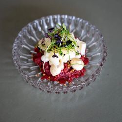 Fleisch - Beef tartare with cheese, creamy elements and fresh sprouts at Restaurant Fleisch in Copenhagen's Meatpacking District.