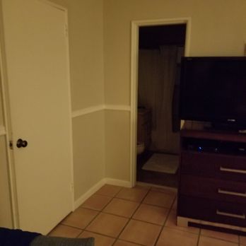 Silver Seas Resort - Bathroom (open door), closet on the left and TV in living room - Hotels Near Me - Fort Lauderdale, Florida Silver Seas Resort - Bathroom (open door), closet on the left and TV in living room - Hotels Near Me - Fort Lauderdale, Florida