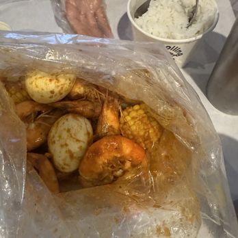 The Boiling Crab - Whole shebang 1 pound shrimp with an order of eggs would usually come three in an order and two corns - Cajun/Creole Near Me - Rowland Heights, California The Boiling Crab - Whole shebang 1 pound shrimp with an order of eggs would usually come three in an order and two corns - Cajun/Creole Near Me - Rowland Heights, California