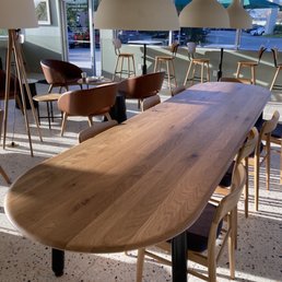 Long, wooden table with 8 chairs Long, wooden table with 8 chairs