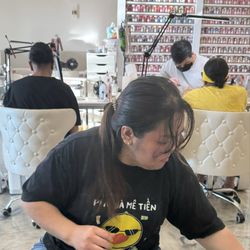 Daisy taking care of my feet while mom and sis get their hands taken care of.