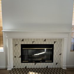 Carlos Handyman - Tile installation around fireplace