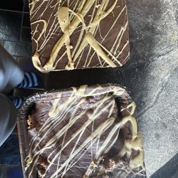 Half the size brownie still in its packaging, crystallized sugar and butter on the bottom. Half the size brownie still in its packaging, crystallized sugar and butter on the bottom.