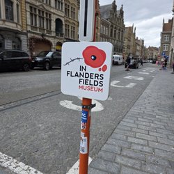 In Flanders Field Museum - The poppy sign in front of the bus parking spots and museum