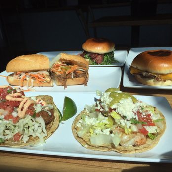 Stacked & Folded - Panko Crusted Avocado Taco, Garlic Shrimp Taco, Duck BLT, Short Rib Bahn Mi, and Pork Belly and Egg Sandwich. - New American Near Me - Winnetka, Illinois Stacked & Folded - Panko Crusted Avocado Taco, Garlic Shrimp Taco, Duck BLT, Short Rib Bahn Mi, and Pork Belly and Egg Sandwich. - New American Near Me - Winnetka, Illinois
