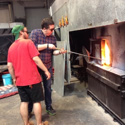 New Orleans Glassworks & Printmaking Studio - Kyle, our instructor assisting during a glassblowing class.