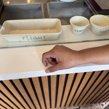 Carmela Ice Cream - One scoop is the small cup to the right and two scoop is the slightly larger cup, lastly the flights are on the left side. - Ice Cream & Frozen Yogurt Near Me - Pasadena, California