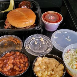 GQue BBQ - Pulled pork sandwich. Mashed potatoes and gravy. Bbq beans. Mac n cheese. Apple slaw.
