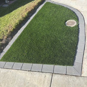 Palm Construction - Turf with paver border on side of driveway - Decks & Railing Near Me - West Covina, California