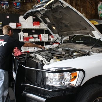 Lube Pit Stop - Working on one of the many big trucks that come in. - Oil Change Stations Near Me - Austin, Texas Lube Pit Stop - Working on one of the many big trucks that come in. - Oil Change Stations Near Me - Austin, Texas