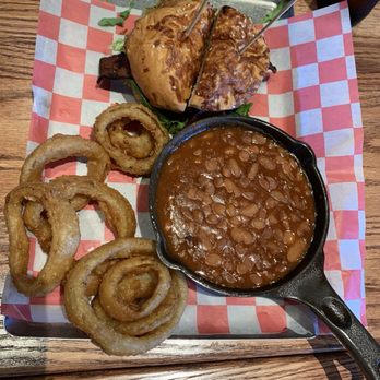Redwood Taphouse - Redwood burger with cheese and bacon with baked beans and onion rings. - Sports Bars Near Me - Porterville, California Redwood Taphouse - Redwood burger with cheese and bacon with baked beans and onion rings. - Sports Bars Near Me - Porterville, California