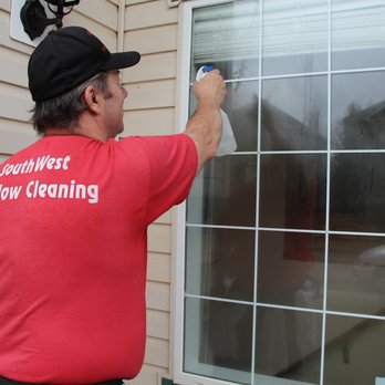 SouthWest Window Cleaning - Step 4 Spray the window with our special Rinsing agent. - Window Washing Near Me - Calgary, Alberta