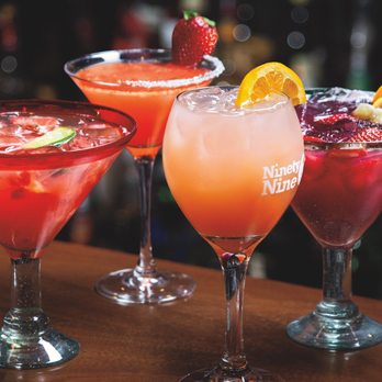99 Restaurants - a variety of cocktails on a bar - Pubs Near Me - Plattsburgh, New York