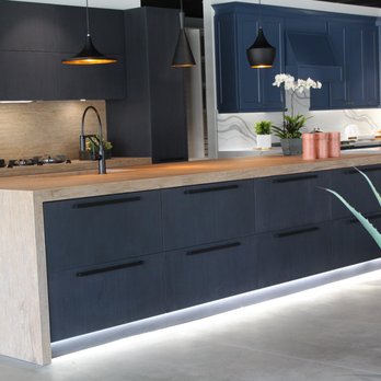 Torossian - Porcelain countertops with waterfall edges. "Toe kick" lighting at the base of the cabinets looks good and is functional. - General Contractors Near Me - Los Angeles, California Torossian - Porcelain countertops with waterfall edges. "Toe kick" lighting at the base of the cabinets looks good and is functional. - General Contractors Near Me - Los Angeles, California