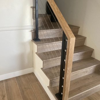 Martin Stairways - Wood railing, silver cables, black posts - General Contractors Near Me Martin Stairways - Wood railing, silver cables, black posts - General Contractors Near Me