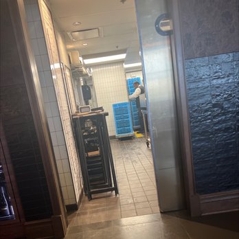 1933 Lounge - Plenty of empty tables and we get the table next to the kitchen. Can hear the employees talking and kitchen noise. - Steakhouses Near Me - Fishers, Indiana