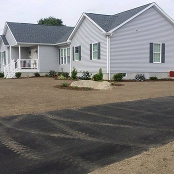 Elf's Landscape - a house with a driveway in front of it - Lawn Services Near Me