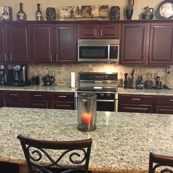 Flooring Warehouse - Silver Travertine back Splash from Flooring Warehouse  with SF Real granite counter tops from Empire in Austin - Flooring Near Me - Georgetown, Texas