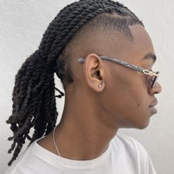 Tha Mane Studio - Loc re-twist and styled with two strand twist.